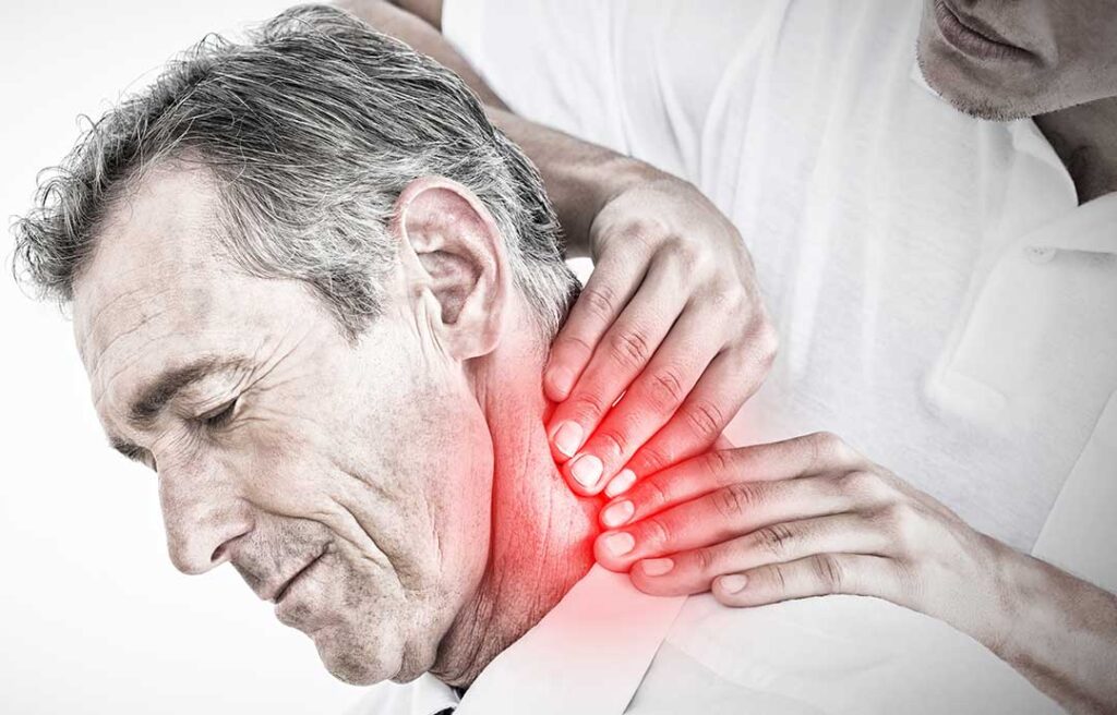 A chiropractor provides an adjustment to a patient lying on a treatment table in a bright, clean clinic.