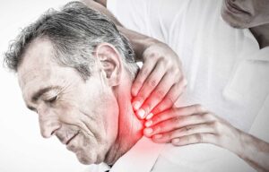 A chiropractor provides an adjustment to a patient lying on a treatment table in a bright, clean clinic.